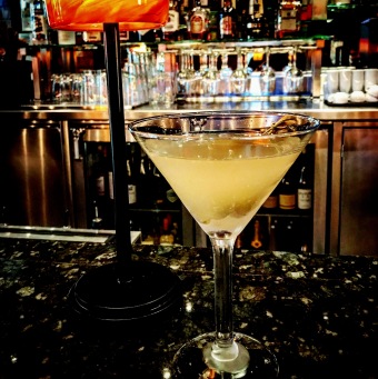The reason you can barely see the Vermouth-soaked, blue cheese-stuffed olives (trust us, they're there and they're spectacular) is that this is what we call a "Filthy Martini." Bottoms up!